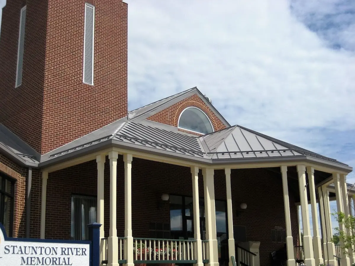Skilled roofing craftsmen working on a residential roof in Falls Hill
